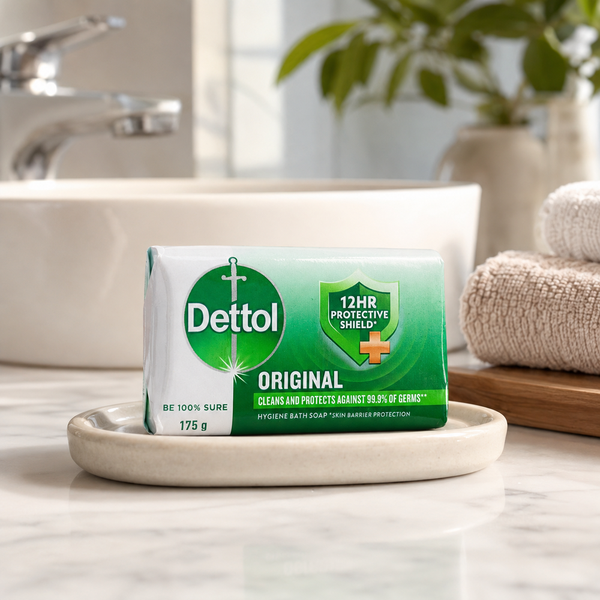 Dettol Original Bath Soap 175g in a ceramic soap dish beside a bathroom basin