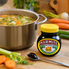 Marmite Yeast Extract 250g jar used as a savoury ingredient beside vegetable soup